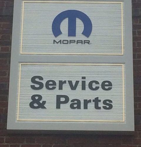 car service and parts sign